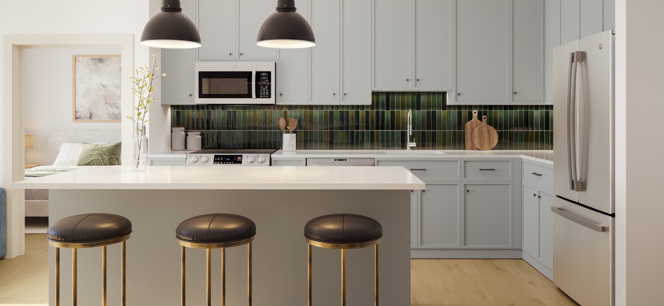 Your Space to Thrive kitchen with ample counter-space, modern appliances and bright lighting